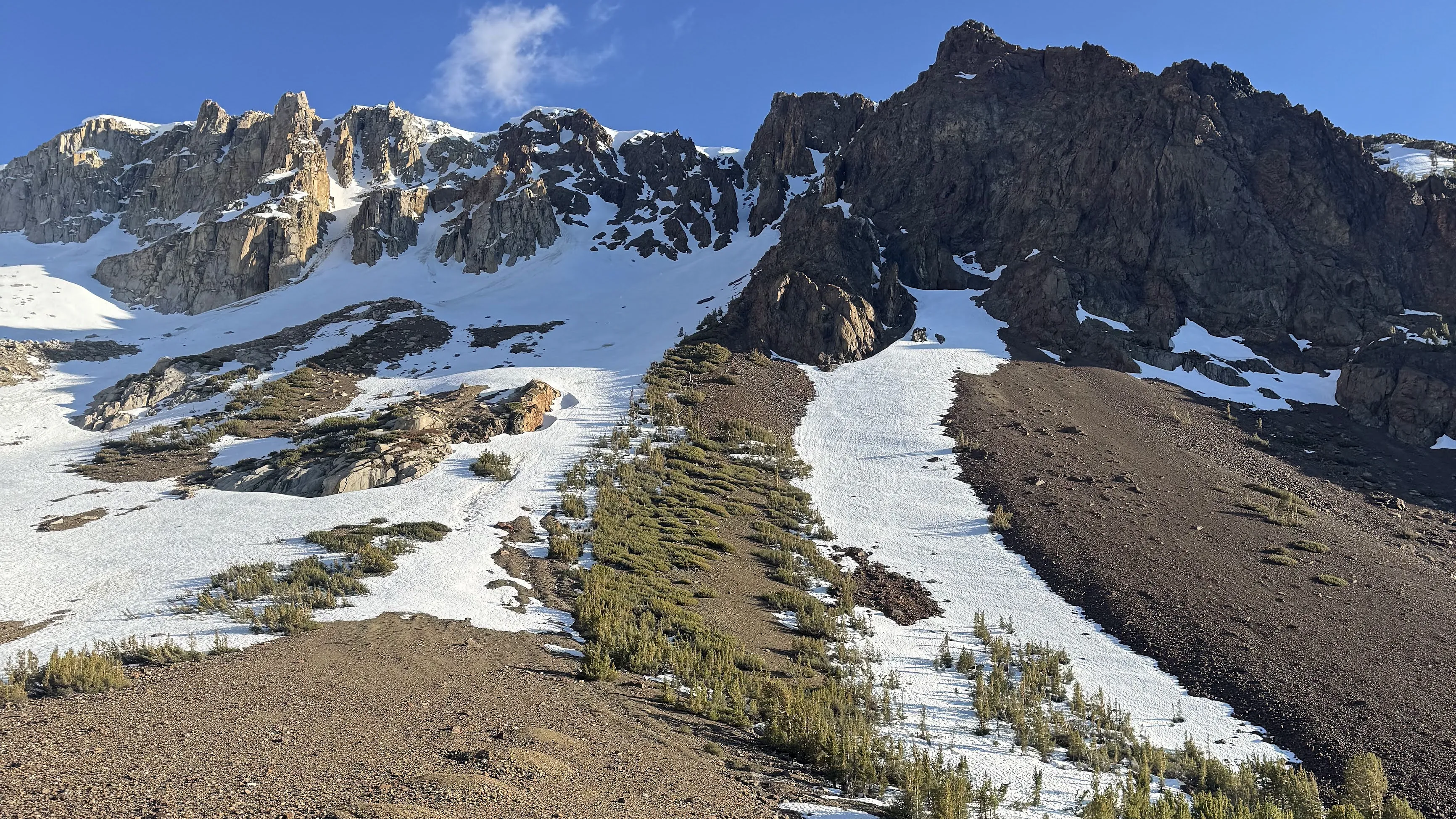Snow and scree below unnamed granite peaks in the high Sierra